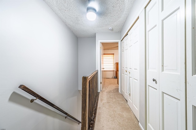 277 Mattix Run Unit 277, Galloway Township, NJ 08205 - corridor featuring an upstairs landing, light colored carpet, and a textured ceiling