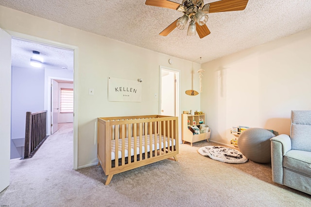 277 Mattix Run Unit 277, Galloway Township, NJ 08205 - carpeted bedroom with a textured ceiling, a crib, and a ceiling fan