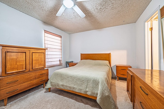 277 Mattix Run Unit 277, Galloway Township, NJ 08205 - bedroom with light colored carpet, a textured ceiling, and ceiling fan