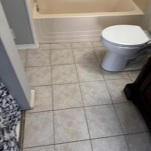 126 Club Pl Unit 126, Galloway Township, NJ 08205 - bathroom featuring tile patterned flooring, toilet, a bath, and a shower