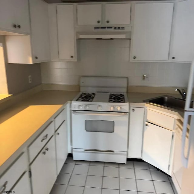 126 Club Pl Unit 126, Galloway Township, NJ 08205 - kitchen with white range with gas cooktop, under cabinet range hood, a sink, backsplash, and white cabinets