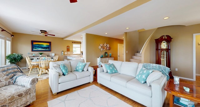 living area with ceiling fan, wood finished floors, stairs, recessed lighting, and baseboards