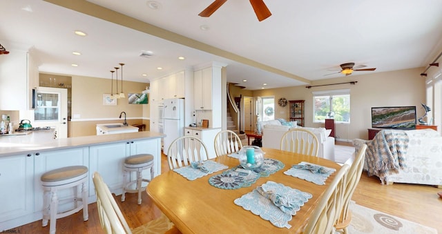 dining room featuring a ceiling fan, light wood-style flooring, and recessed lighting