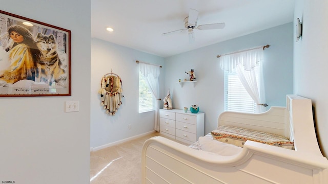 bedroom with light carpet, ceiling fan, baseboards, and recessed lighting