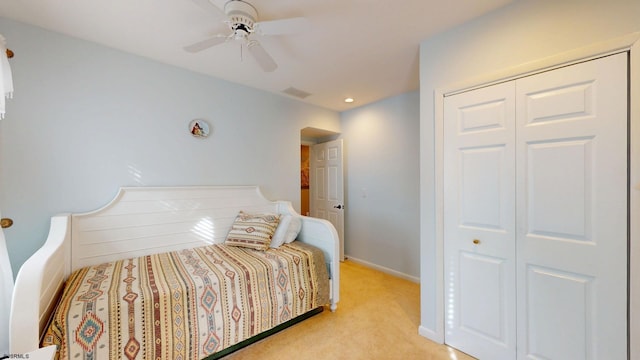 bedroom featuring light carpet, a closet, ceiling fan, baseboards, and recessed lighting