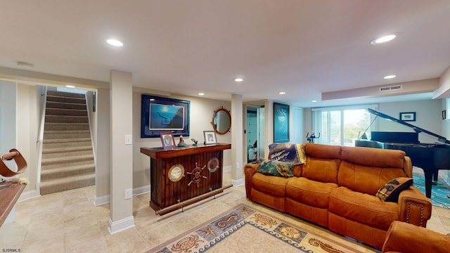 living area featuring recessed lighting, stairway, baseboards, and light tile patterned flooring