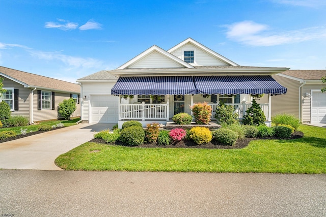 2058 Rte 9, Ocean View, NJ 08230 - view of front of home with a garage, covered porch, concrete driveway, and a front yard
