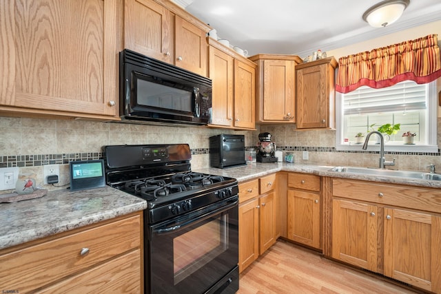 2058 Rte 9, Ocean View, NJ 08230 - kitchen featuring black appliances, a sink, decorative backsplash, and light wood-style flooring