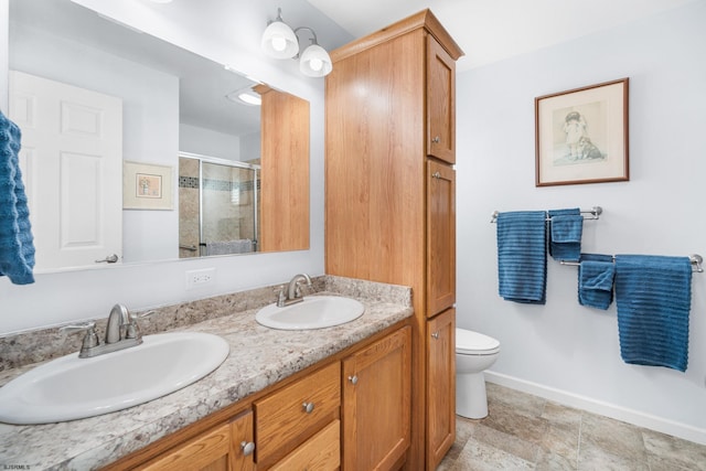 2058 Rte 9, Ocean View, NJ 08230 - bathroom with a shower stall, baseboards, double vanity, and toilet