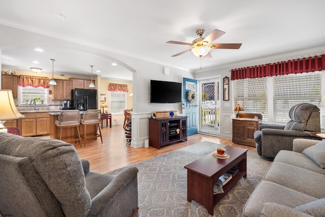 2058 Rte 9, Ocean View, NJ 08230 - living area with arched walkways, ceiling fan, light wood finished floors, ornamental molding, and wainscoting
