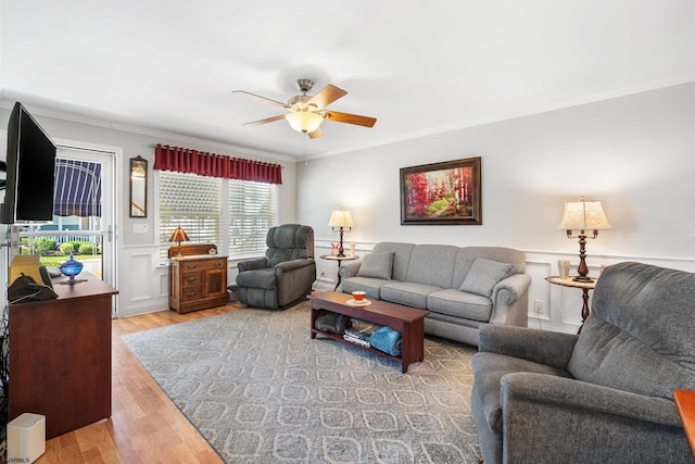 2058 Rte 9, Ocean View, NJ 08230 - living area with ornamental molding, a ceiling fan, wood finished floors, a wainscoted wall, and a decorative wall