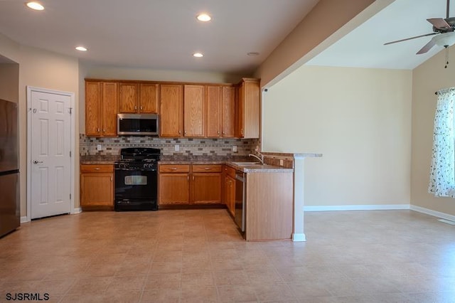 101 Sea Foam Rd, Egg Harbor Township, NJ 08234 - kitchen featuring stainless steel appliances, tasteful backsplash, a ceiling fan, brown cabinets, and recessed lighting