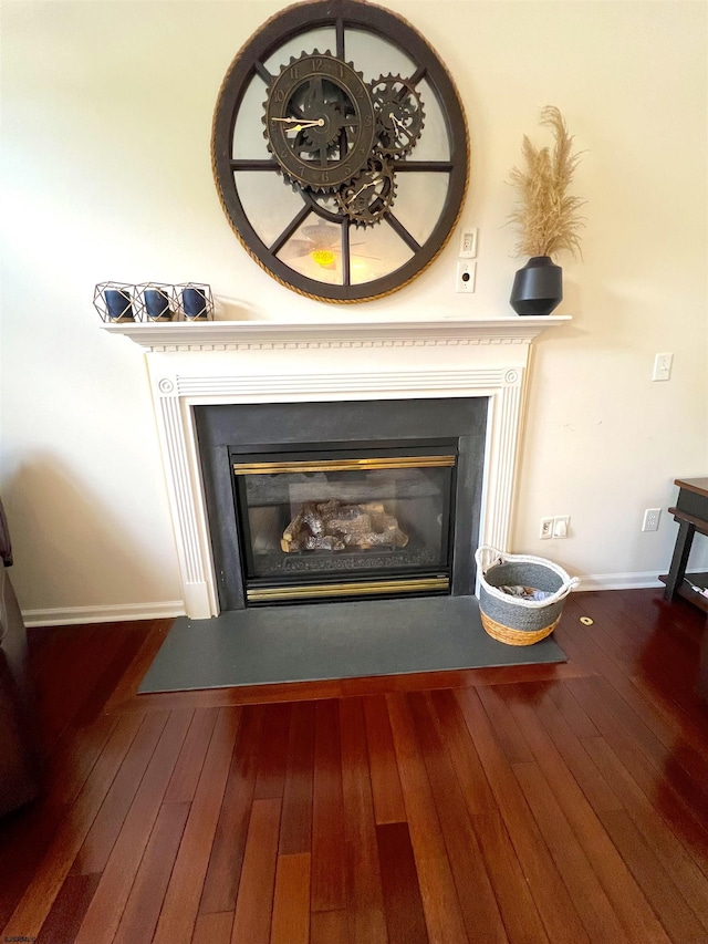 11 Gallant Fox Ln, Egg Harbor Township, NJ 08234 - detailed view of a glass covered fireplace, wood finished floors, and baseboards