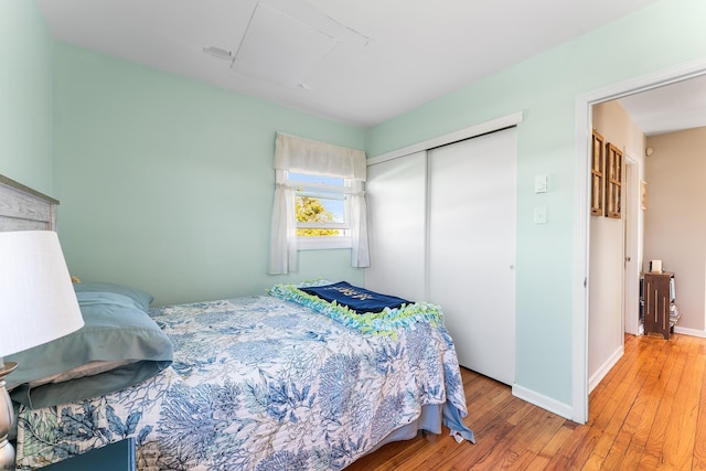 4400 Harbor Beach Blvd, Brigantine, NJ 08203 - bedroom with wood finished floors, a closet, and baseboards
