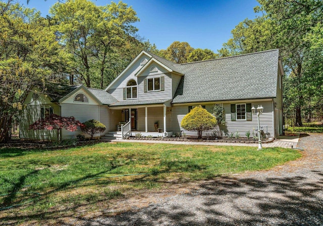 131 S Zurich Ave, Egg Harbor City, NJ 08215 - view of front of home with covered porch, a front lawn, and a shingled roof