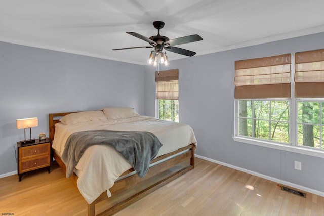4768 Summersweet Dr Unit 4768, Mays Landing, NJ 08330 - bedroom with multiple windows, baseboards, wood finished floors, and ornamental molding