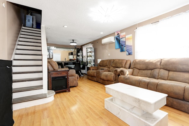 15 N Marion Ave, Ventnor, NJ 08406 - living area featuring an AC wall unit, stairs, light wood finished floors, and recessed lighting