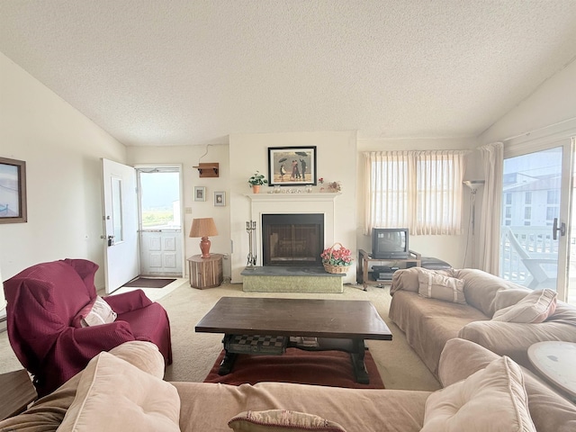 4102 W Ave Unit 2, Ocean City, NJ 08226 - living room with vaulted ceiling, a textured ceiling, plenty of natural light, carpet, and a fireplace with raised hearth