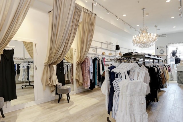 9315 Ventnor Ave, Margate, NJ 08402 - walk in closet featuring light wood-style floors and a chandelier