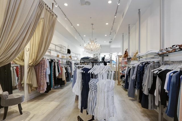 9315 Ventnor Ave, Margate, NJ 08402 - walk in closet featuring light wood finished floors and a chandelier