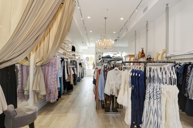 9315 Ventnor Ave, Margate, NJ 08402 - walk in closet featuring a chandelier and light wood-style floors