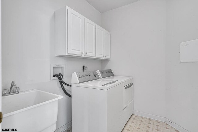 317 Southmoor Dr, Galloway Township, NJ 08205 - washroom featuring washing machine and clothes dryer, cabinet space, light floors, and baseboards