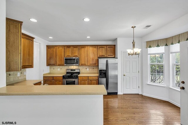 317 Southmoor Dr, Galloway Township, NJ 08205 - kitchen with stainless steel appliances, dark wood-type flooring, light countertops, backsplash, and recessed lighting