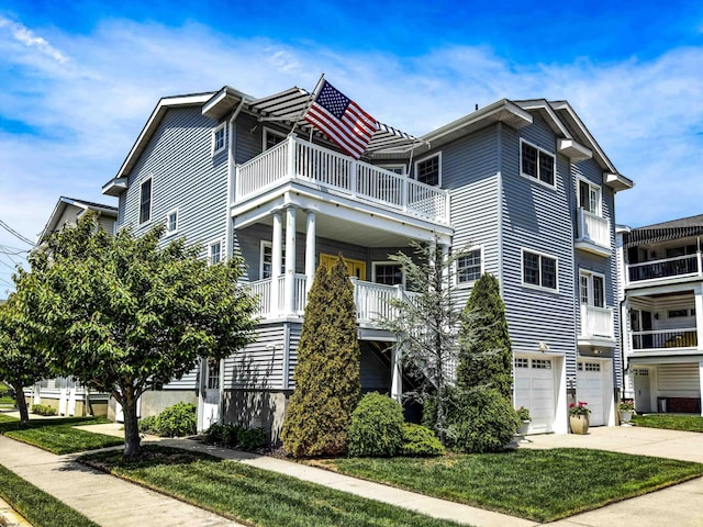 818 Aldrich Rd Fl 2Nd, Ocean City, NJ 08226 - view of front of home featuring a balcony, an attached garage, concrete driveway, and a front yard