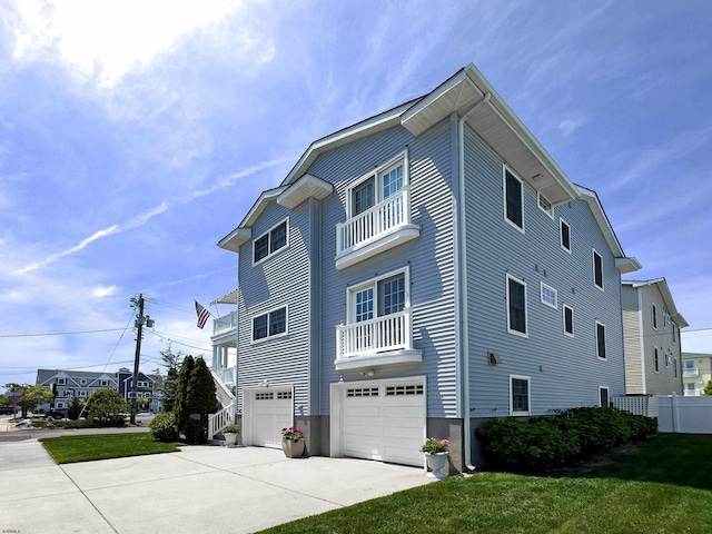 818 Aldrich Rd Fl 2Nd, Ocean City, NJ 08226 - view of home's exterior with a balcony, an attached garage, driveway, and a yard