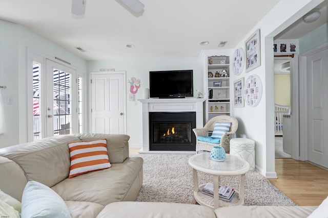 818 Aldrich Rd Fl 2Nd, Ocean City, NJ 08226 - living area featuring wood finished floors, a lit fireplace, a ceiling fan, baseboards, and recessed lighting