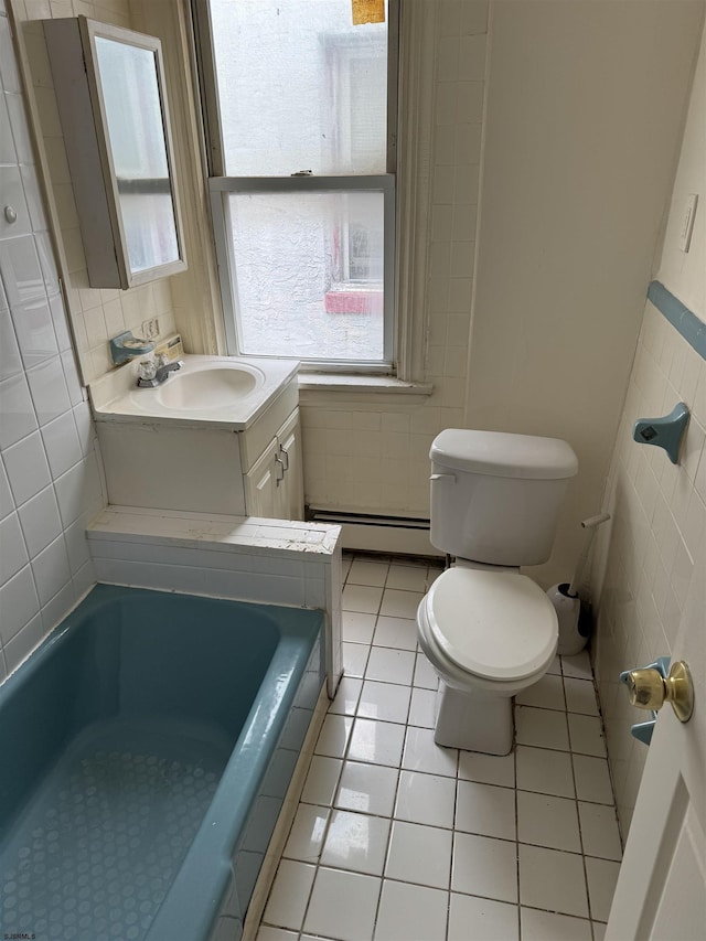 2015 Grant Ave, Atlantic City, NJ 08401 - full bathroom featuring plenty of natural light, a baseboard radiator, toilet, a bathtub, and tile walls