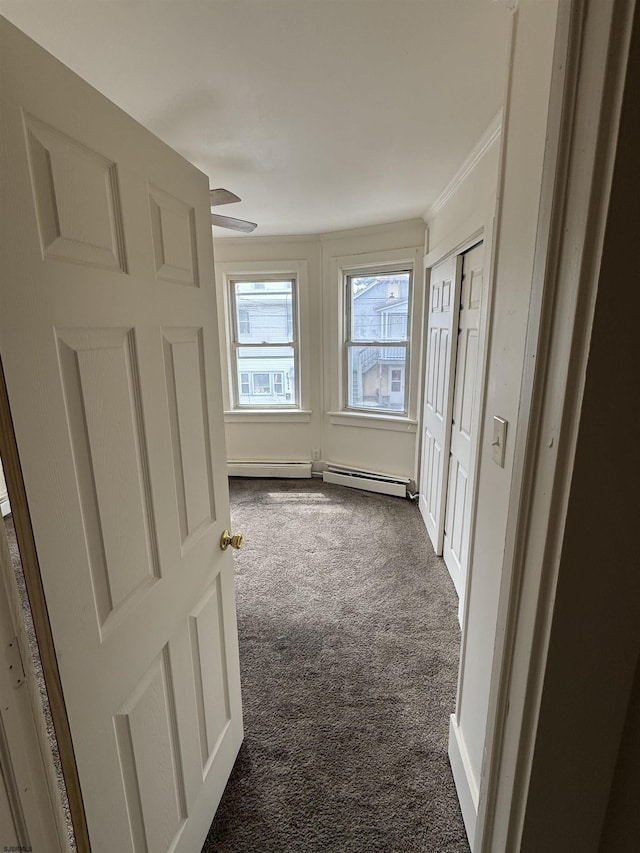2015 Grant Ave, Atlantic City, NJ 08401 - hallway featuring dark carpet, crown molding, and a baseboard radiator