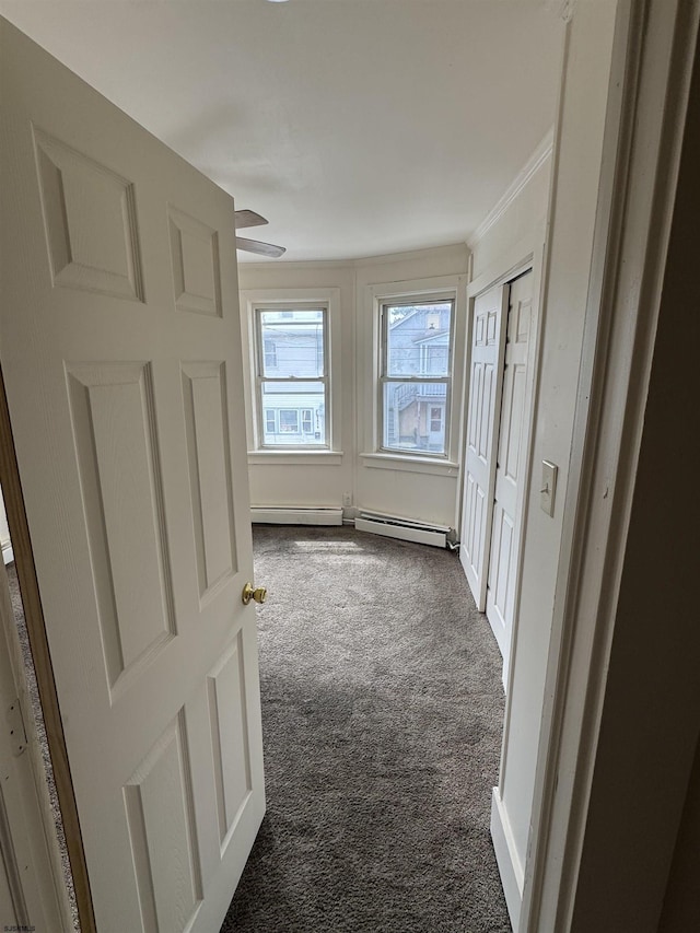 2015 Grant Ave, Atlantic City, NJ 08401 - corridor featuring dark colored carpet, ornamental molding, and a baseboard heating unit