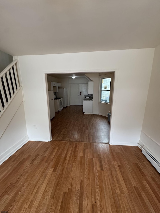 2015 Grant Ave, Atlantic City, NJ 08401 - unfurnished living room with baseboard heating, wood finished floors, stairs, and baseboards