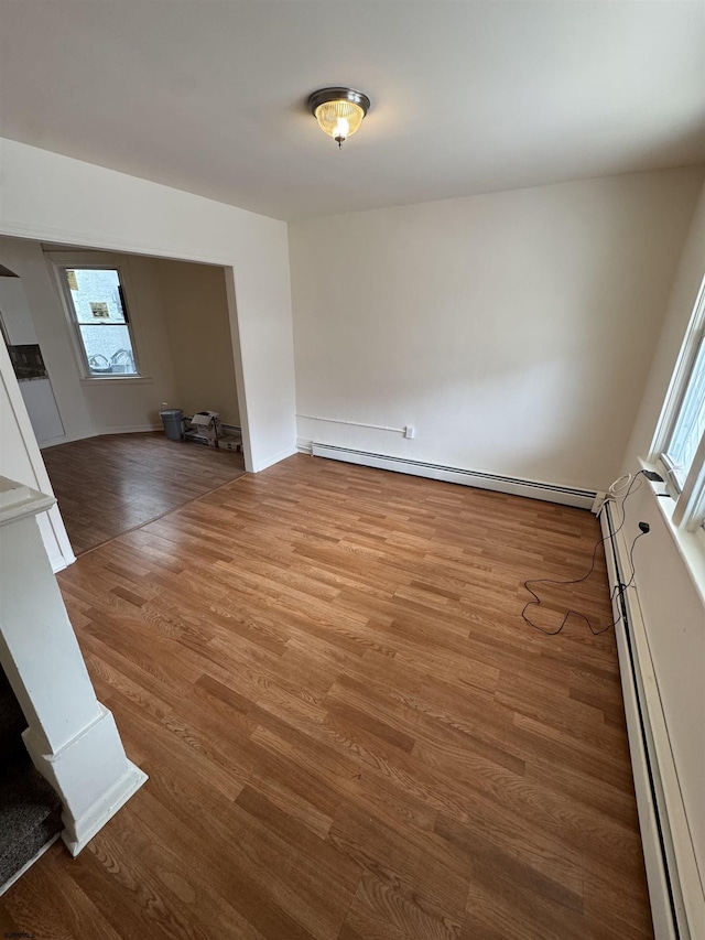 2015 Grant Ave, Atlantic City, NJ 08401 - spare room with baseboard heating, wood finished floors, and plenty of natural light