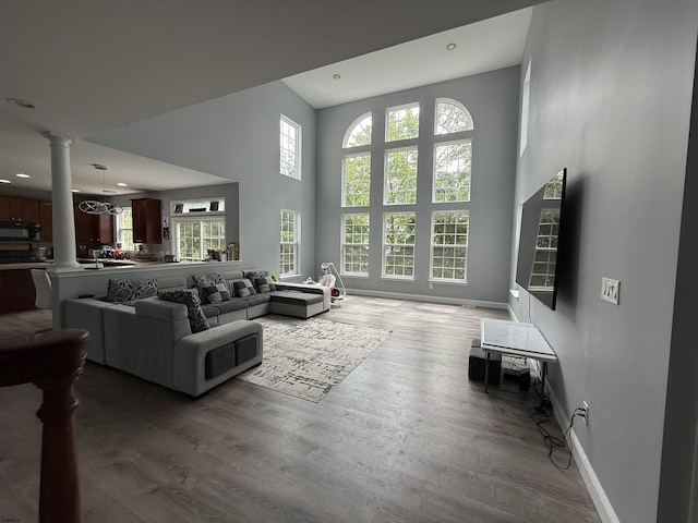 127 Rockport, Egg Harbor Township, NJ 08234 - living area with ornate columns, plenty of natural light, baseboards, a high ceiling, and wood finished floors