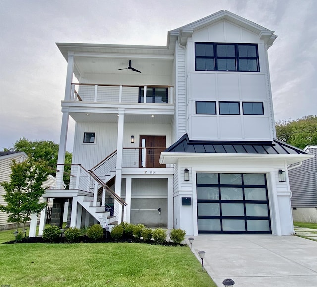 116 Bayshore Ave, Brigantine, NJ 08203 - view of front facade with a balcony, a standing seam roof, stairs, and a garage