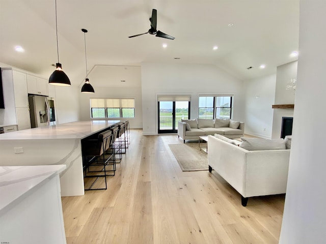 116 Bayshore Ave, Brigantine, NJ 08203 - living area featuring ceiling fan, light wood-style floors, high vaulted ceiling, and recessed lighting