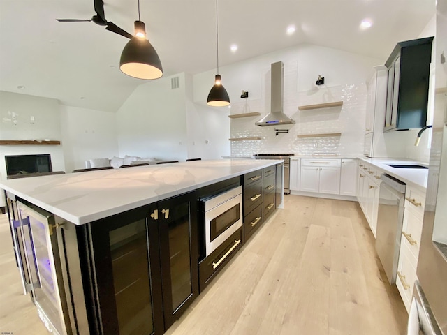 116 Bayshore Ave, Brigantine, NJ 08203 - kitchen with island range hood, lofted ceiling, appliances with stainless steel finishes, a sink, and dark cabinets