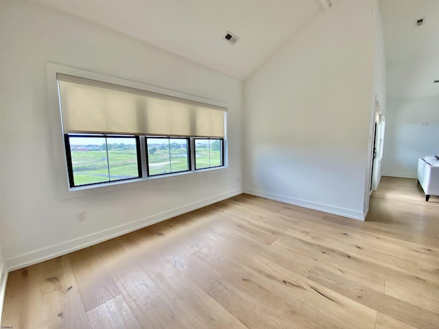 116 Bayshore Ave, Brigantine, NJ 08203 - spare room with high vaulted ceiling, light wood-style floors, and baseboards