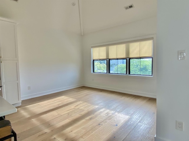 116 Bayshore Ave, Brigantine, NJ 08203 - spare room featuring light wood-style floors, baseboards, and high vaulted ceiling