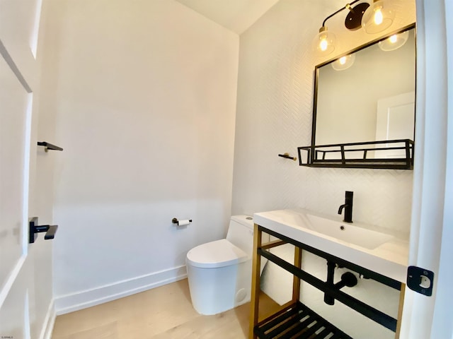 116 Bayshore Ave, Brigantine, NJ 08203 - half bath with toilet, wood finished floors, baseboards, and vanity