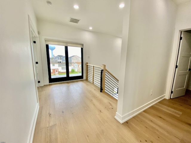 116 Bayshore Ave, Brigantine, NJ 08203 - corridor featuring light wood finished floors, baseboards, recessed lighting, and an upstairs landing