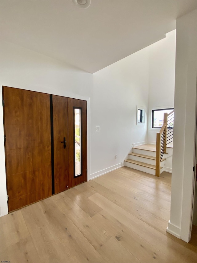 116 Bayshore Ave, Brigantine, NJ 08203 - foyer with stairway, wood-type flooring, and baseboards