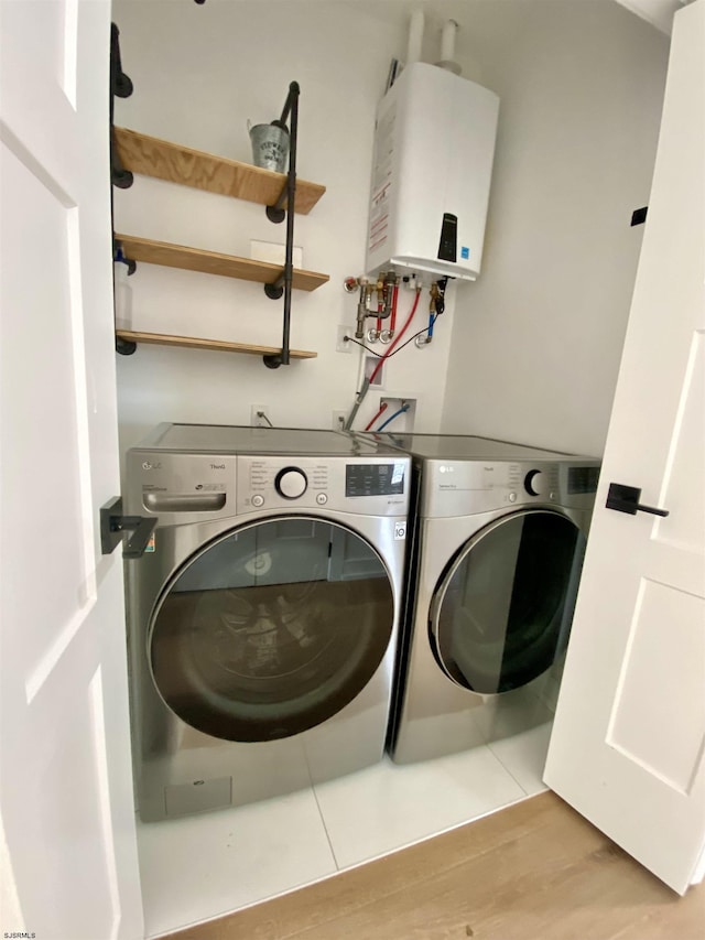 116 Bayshore Ave, Brigantine, NJ 08203 - laundry area featuring water heater, independent washer and dryer, and light wood-style flooring