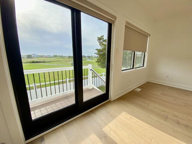 116 Bayshore Ave, Brigantine, NJ 08203 - doorway with wood finished floors, baseboards, and golf course view