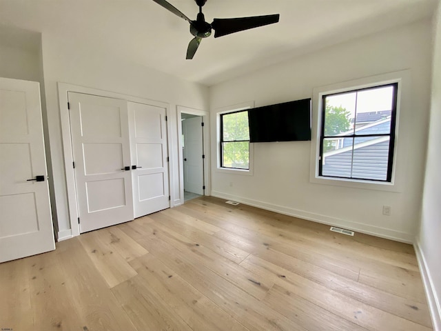 116 Bayshore Ave, Brigantine, NJ 08203 - unfurnished bedroom featuring light wood-style flooring, baseboards, a closet, and ceiling fan