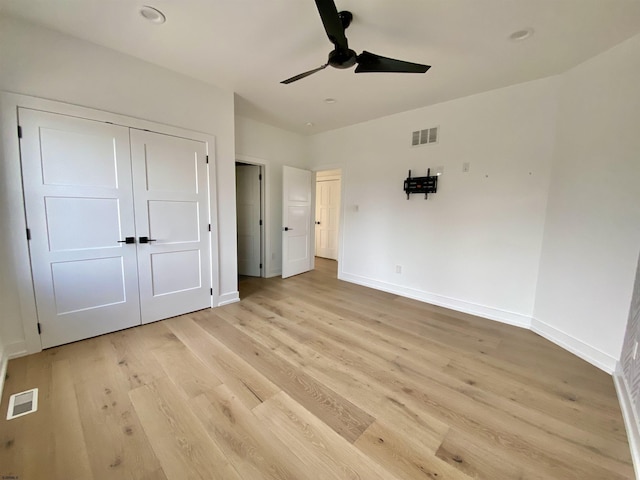 116 Bayshore Ave, Brigantine, NJ 08203 - unfurnished bedroom featuring baseboards, light wood-style flooring, a closet, and a ceiling fan