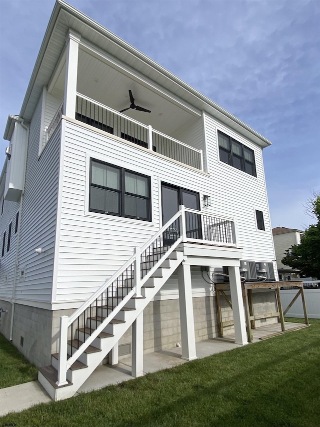 116 Bayshore Ave, Brigantine, NJ 08203 - rear view of property featuring a ceiling fan, a balcony, and stairway
