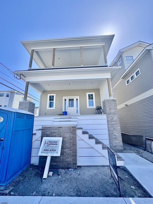 308 13th St, Ocean City, NJ 08226 - view of front of property with stairway, covered porch, and brick siding